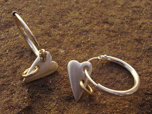 heart shaped silver sleeper earrings.