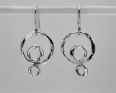 Sterling silver textured circle drop earrings feature three individually formed circles