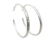 Pair of titanium hoop earrings featuring beautifully textured detailing