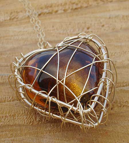 Cage heart gold necklace