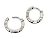 Round titanium hoop earrings in natural grey