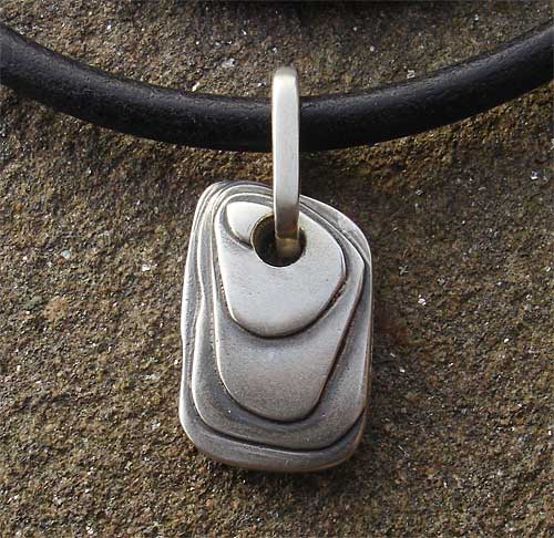 Contemporary mens silver pendant