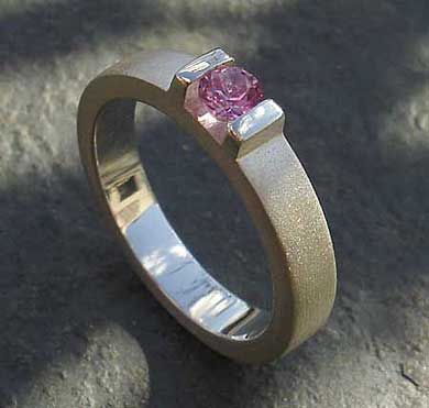 Contemporary pink sapphire engagement ring