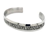 Titanium cuff bracelet with a leopard print design