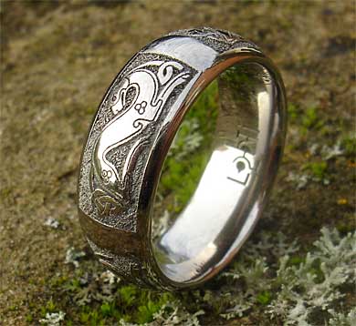 Titanium ring with an engraved Celtic dog pattern