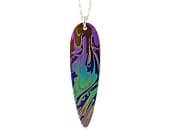 Contemporary titanium pendant with an elegant swirling pattern