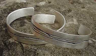 Etched silver bracelets