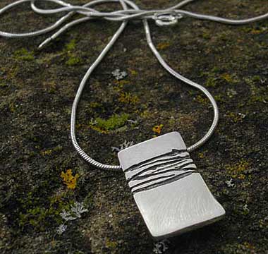 Etched silver designer necklace