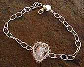 Handmade caged heart silver bracelet