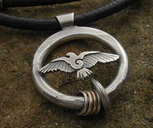 Handmade hammered silver pendant
