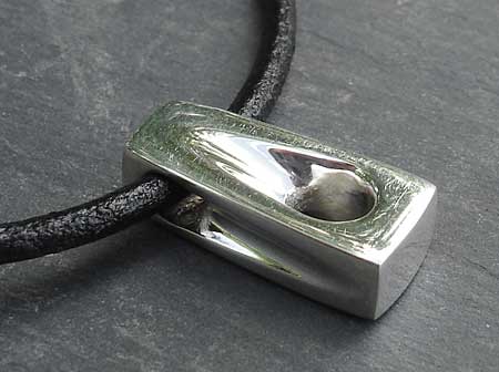 Handmade polished silver pendant