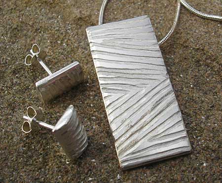 Handmade silver earrings and necklace