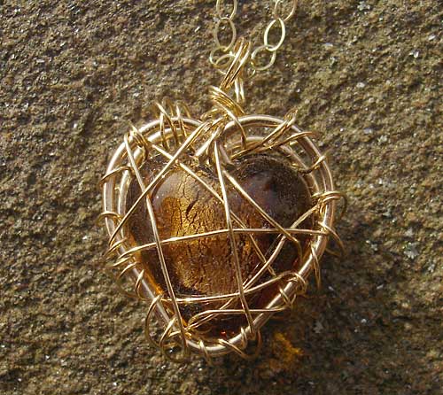 Heart cage gold necklace