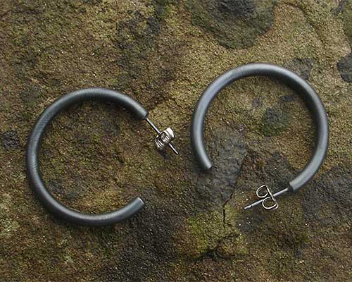Large black titanium round hoop earrings
