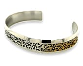 Titanium cuff bracelet with a leopard print design