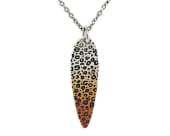 Titanium pendant featuring a leopard print design