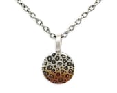 Titanium necklace featuring a leopard print pattern