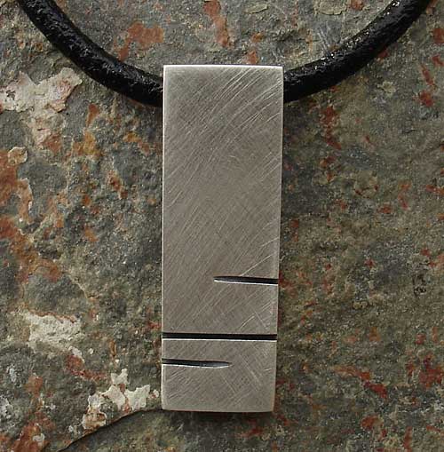Mens and womens silver pendant