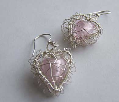 Pink heart shape cage earrings