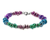 Titanium bracelet featuring a mix of multi-coloured coiled rings