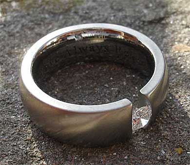 Tension set diamond engagement ring