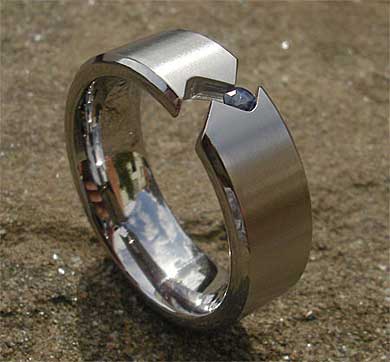 Tension set titanium sapphire engagement ring