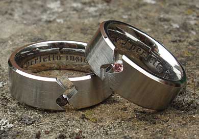 Tension set titanium sapphire engagement rings