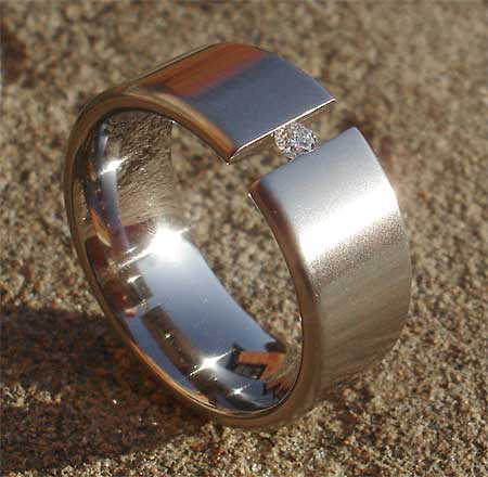 Tension diamond titanium engagement ring