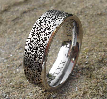 Textured surface titanium ring