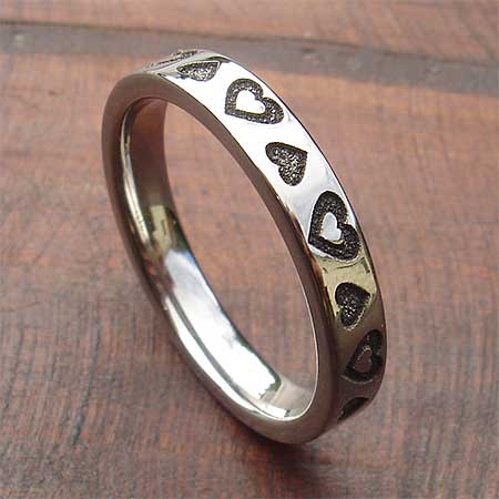 Titanium ring with hearts