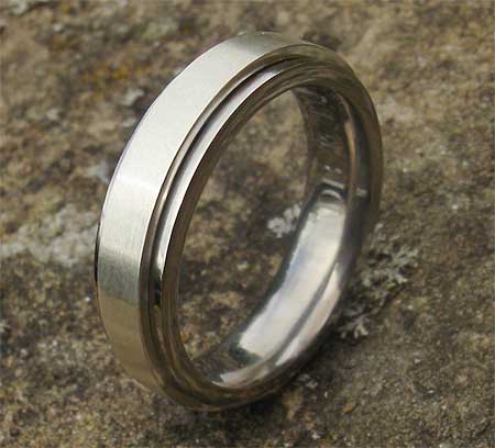 Titanium and silver spinning wedding ring