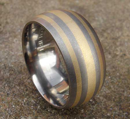 Titanium wedding ring with inlaid gold