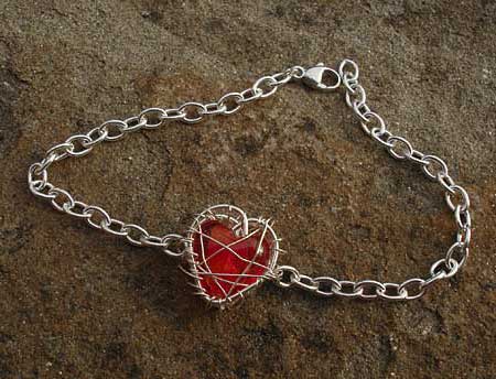 Unusual red heart silver bracelet