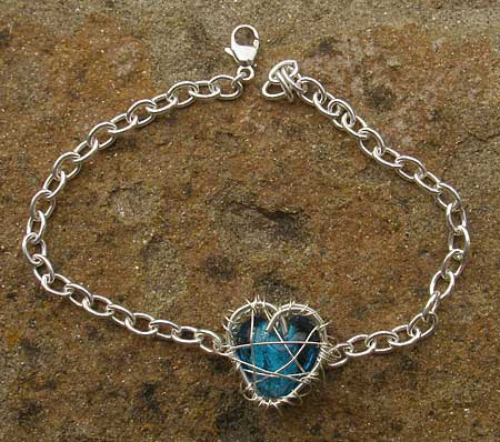 Unusual silver heart bracelet for women