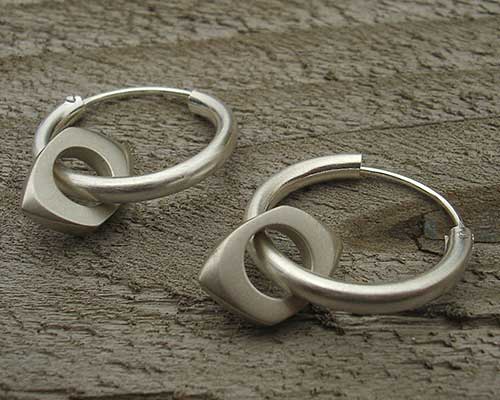 Unusual silver sleeper earrings