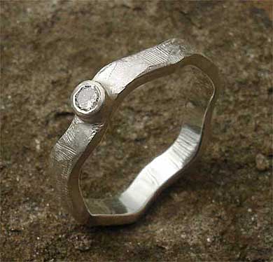 Unusual engagement ring in silver