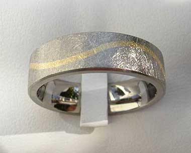 Wavy inlay titanium wedding ring