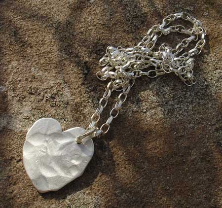 Womens beaten silver heart necklace