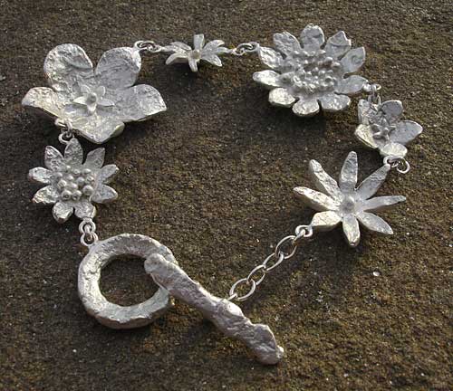 Womens contemporary silver flower bracelet
