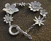 Womens contemporary silver flower bracelet