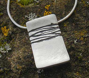 Womens etched silver designer necklace