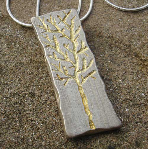 Womens gold etched necklace